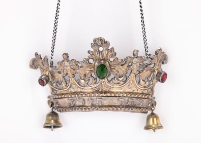 25. A SILVER CROWN ON A CHAIN. Part of an early Italian torah shield. Embossed with Keter Torah.