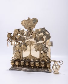 38. A LARGE BRASS HANUKKAH LAMP. Warsaw circa 1900. he back plate is decorated with two lions each