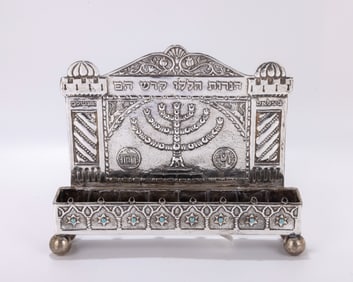 40. A STERLING SILVER HANUKKAH LAMP. Israel, 20th century. On four balled feet with eight large oil