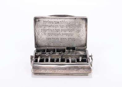 47. A TRAVELLING SILVER HANUKKAH LAMP. Box form. Opens to reveal nine oil and wick holders and oil