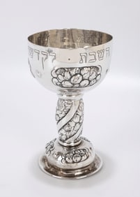 56. Germany, 20th century. On a small base chased with flowers. Wide stem decorated with floral