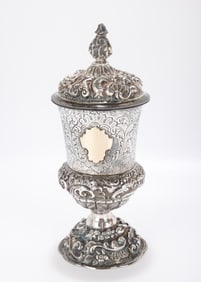 58. A LARGE SILVER COVERED GOBLET. Germany, 19th century. On a chased and domed base. The main