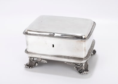59. A LARGE SILVER ETROG BOX. Warsaw, c. 1850. On four legs with a rectangular body and acanthus