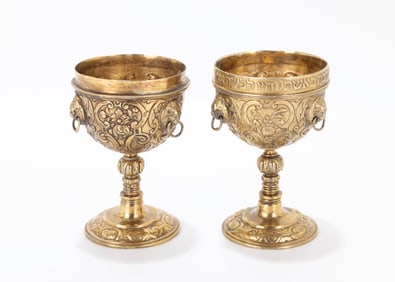 64. A PARCEL GILT WEDDING GOBLET SET. In German style, 20th century. Interlocking goblets decorated