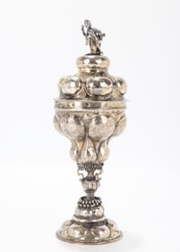 65. AN EARLY COVERED SILVER GOBLET. Nuremberg, 18th century. On a domed handchased base with an