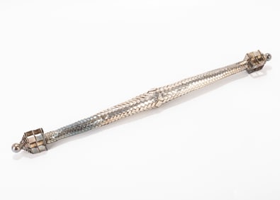 73. A HASIDIC SILVER SPICE CONTAINER. 20th century. In the shape of a n elongated tube. 14' long.