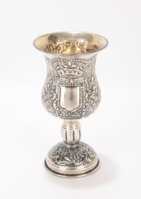 74. A SILVER KIDDUSH GOBLET. Portugal, c. 1990. Traditional form with chased grapevine leaf design.