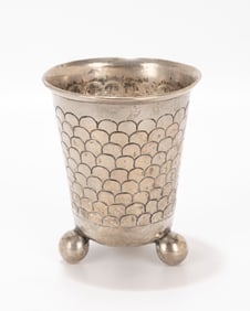 76. A SILVER KIDDUSH FOOTED BEAKER. Nuremberg, c. 1860. On three balled feet with horseshoe chased