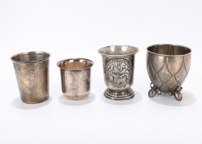 83. A GROUP OF FOUR SILVER BEAKERS. Continental, 19th century. Various forms. One with a later