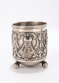 85. A LARGE SILVER KIDDUSH CUP. Probably Hanau, c. 1900. On three ball feet. With reliefs of Moses,