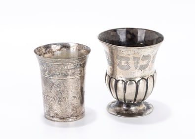 93. TWO SILVER KIDDUSH BEAKER. Germany, c. 1800. One is on a round base and the other simple beaker