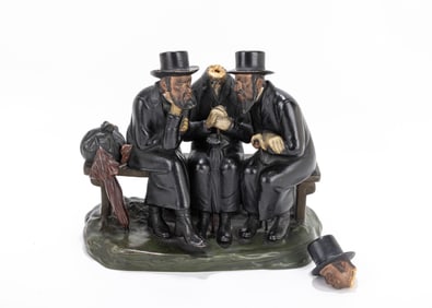 99. A LARGE FIGURINE OF THREE JEWS IN DISCUSSION. Czechoslovakia, c. 1920. Three orthodox Jewish men