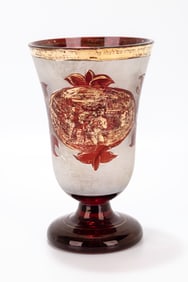 103. A RUBY GLASS KIDDUSH CUP. Bohemia, c. 1920. With a red base and pomegranate main body designs.