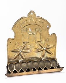 105. A BRASS HANUKKAH LAMP. The Netherlands, 19th century. The backplate is embossed with two six