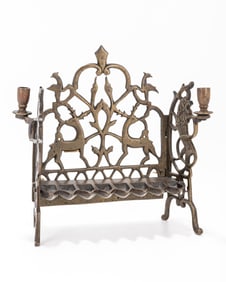 109. A BRASS HANUKKAH LAMP. Poland, 19th century. The back plate is pierced with stags, and floral