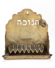 113. A BRASS HANUKKAH LAMP. The Netherlands, c. 1920. Hand chased and cut brass sheet metal
