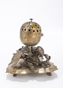 128. A BRASS SPICE CONTAINER. Ottoman Empire, c. 1890. On a stylized triangular base with a pomander