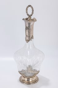 135. A SILVER AND ETCHED GLASS WINE BOTTLE.Vienna, c. 1880. Engraved on the upper silver portion
