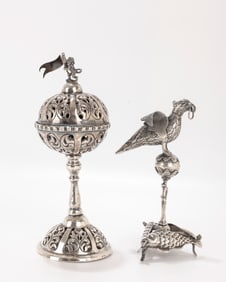 137. TWO SILVER SPICE CONTAINERS. The first is on a pierced dome base with a spherical upper portion