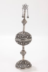142. A RARE AND EARLY SILVER SPICE CONTAINER BY THE BEZALEL SCHOOL. Jerusalem, c. 1910. On a round