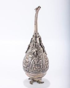 160. A HEAVY SILVER ROSEWATER CONTAINER. Egypt, c. 1900. On leaf stem with twisted style body and