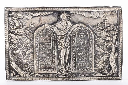 162. A LARGE SILVER JUDAIC PLAQUE. Showing Moses holding up the Decalogue. The background is