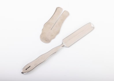 163. A STAINLESS STEEL MILAH KNIFE AND GUARD. Miller's brand, United States, 20th century.