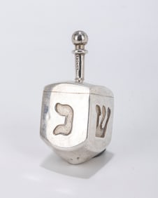 164. A SOLID STERLING SILVER DREIDEL BY TIFFANY. New York, c.1990. Engraved with the Hebrew l