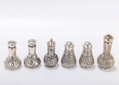185. A GROUP OF SIX STERLING SILVER SALT SHAKERS. Including two pairs and two singles. Makers