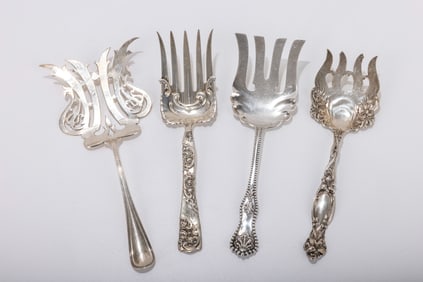 187. A GROUP OF FOUR ANTIQUE AMERICAN STERLING SILVER ASPARAGUS SERVING FORKS. Makers include