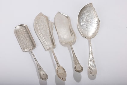 189. A GROUP OF FOUR LARGE AMERICAN STERLING AND COIN SILVER FISH SERVING PIECES. Two are sterling