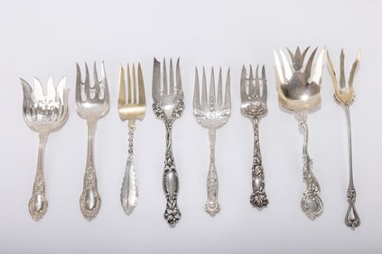 190. A GROUP OF EIGHT AMERICAN STERLING SILVER SERVING FORKS. Various makers. Average size about 8