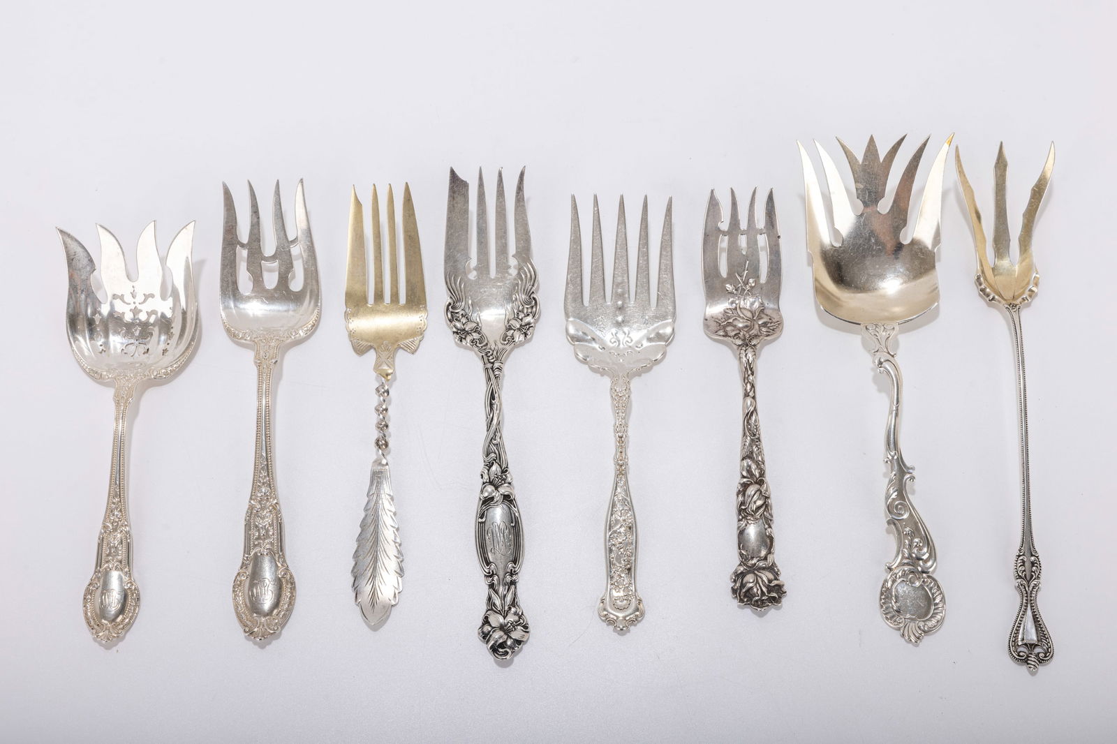 190. A GROUP OF EIGHT AMERICAN STERLING SILVER SERVING FORKS. Various makers. Average size about 8 (1 of 1)