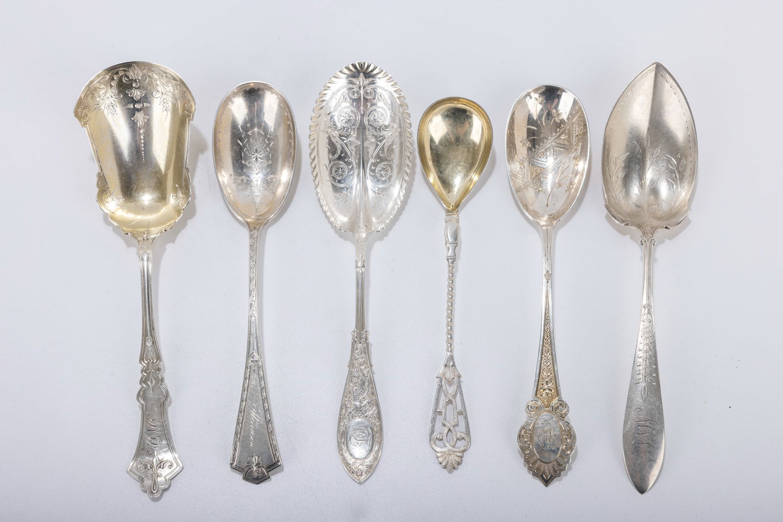 191. A GROUP OF SIX AMERICAN STERLING AND COIN SILVER SERVING SPOONS. Each one is about 9 inches. In (1 of 1)
