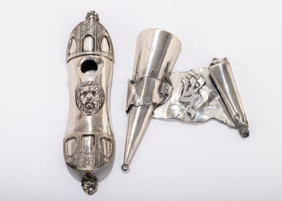 211. TWO STERLING SILVER MEZUZOT. Modern. The first with an applied lion head. The second in