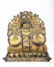 216. A BRASS CHANUKAH LAMP. The Netherlands, 18th century. The back plate is cut with a heart shaped