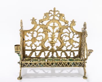 217. A LARGE BRASS HANUKKAH LAMP. Poland, c. 1880 On four feet with pierced backplate decorated with