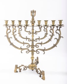 229. A LARGE STANDING MENORAH. Dutch, 19th century. With later repairs. On three legs with a