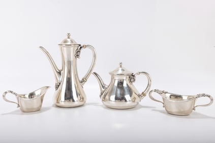 231. A STERLING SILVER TEA SET BY TIFFANY AND COMPANY. New York, c. 1940. Decorated with