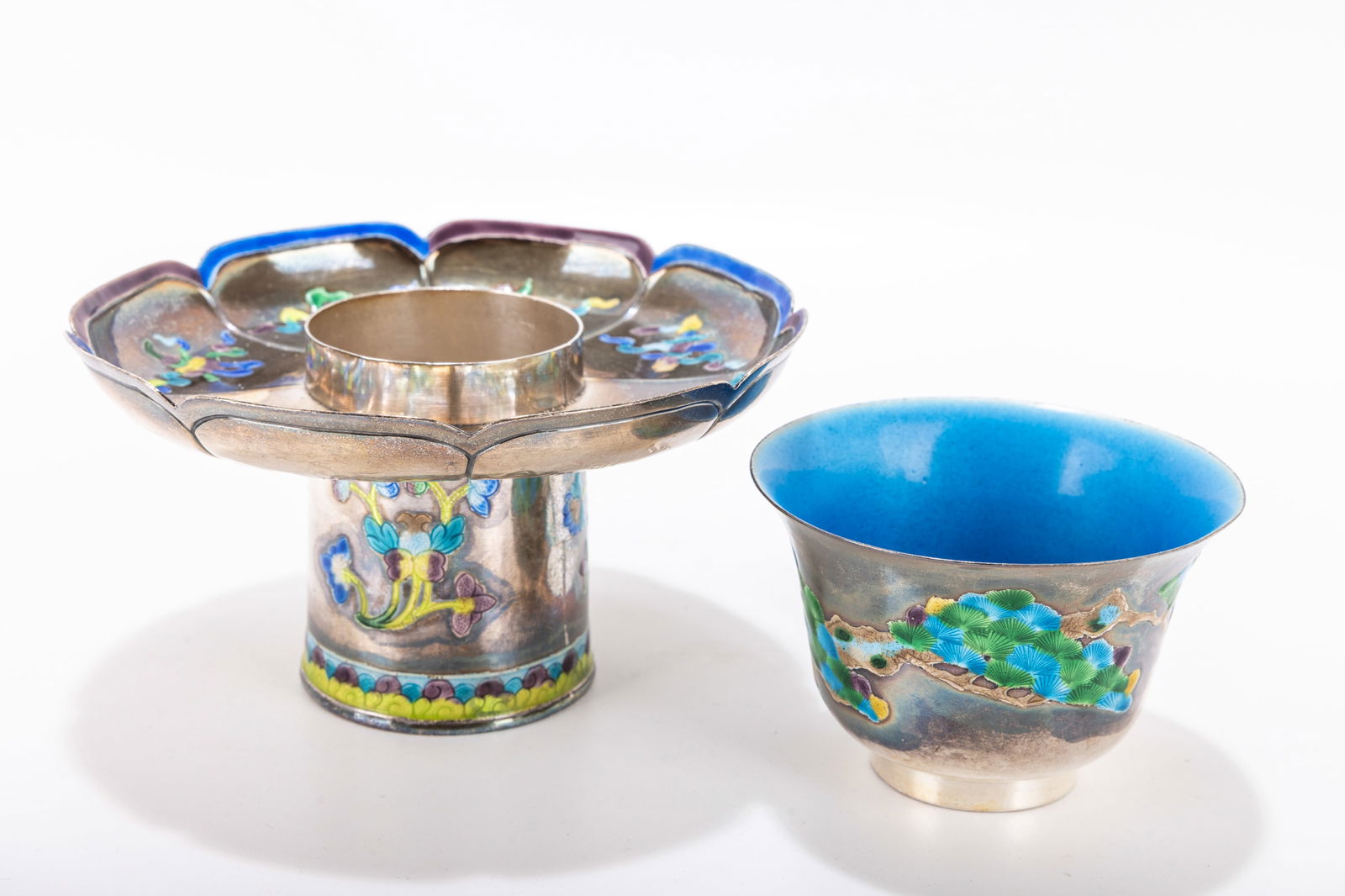 232. A SILVER AND ENAMEL CHINESE TEA CUP WITH UNDERPLATE. C. 1940. Painted with colorful decoration. (1 of 1)