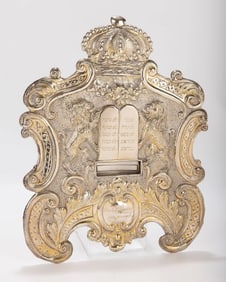 A LARGE SILVER TORAH SHIELD. Vienna, c. 1915. Embossed with two lions flanking a Decalogue, a crown