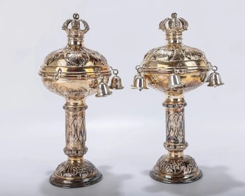 A PAIR OF SILVER TORAH FINIALS. Vienna, c. 1910. On a round embossed base. Engraved with central des
