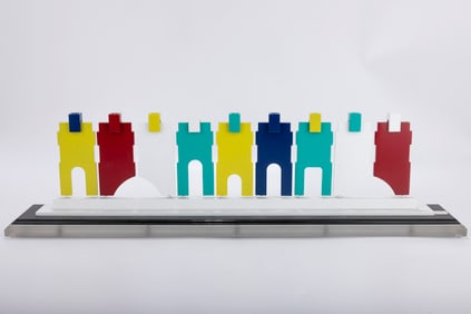 A COLORED ALUMINUM MENORAH BY MICHAEL ENDE. Jerusalem, c. 1980. Consisting of multicolored aluminum