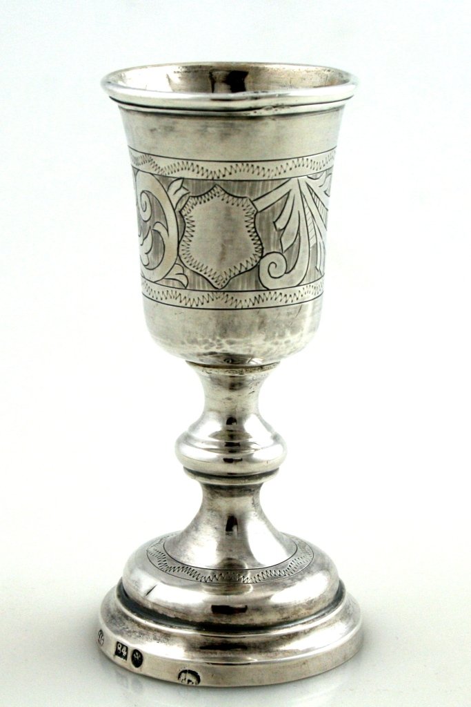 A SILVER KIDDUSH GOBLET BY ISAAC GOLDMAN. Warsaw, c.188: A SILVER KIDDUSH GOBLET BY ISAAC GOLDMAN. Warsaw, c.1880. On round base with engraved upper section. 4” tall. Estimate $300 – 400