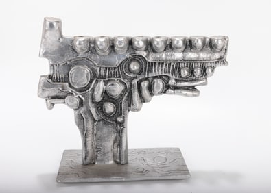 A LARGE ALUMINUM MENORAH SCULPTURE BY DON DRUMM (American, b. 1935).