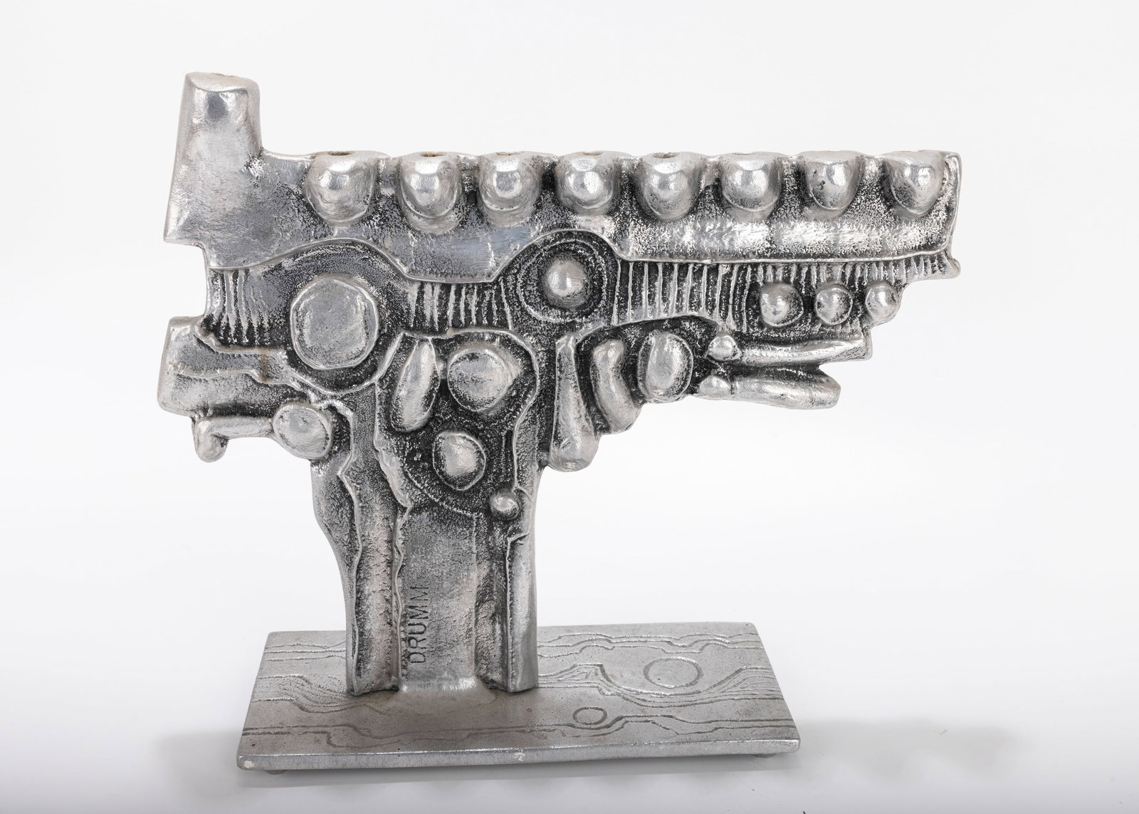 A LARGE ALUMINUM MENORAH SCULPTURE BY DON DRUMM (American, b. 1935). (1 of 4)