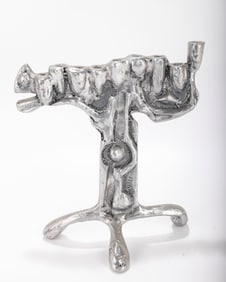AN ALUMINUM MENORAH SCULPTURE BY DON DRUMM (American, b. 1935).