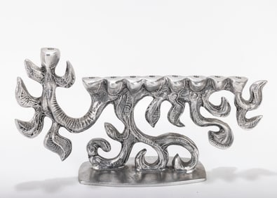AN ALUMINUM MENORAH SCULPTURE BY DON DRUMM (American, b. 1935).