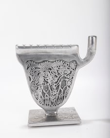 AN ALUMINUM MENORAH SCULPTURE BY DON DRUMM (American, b. 1935).