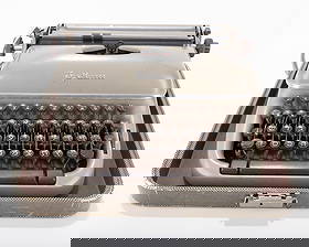 AN ANTIQUE HEBREW - YIDDISH TYPEWRITER BY OPTIMA.: AN ANTIQUE HEBREW - YIDDISH TYPEWRITER BY OPTIMA. Apparently the Elite # 2 models. In the original case. Evidence of mold. Estimate $100 - 200